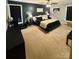 Spacious bedroom with dark accent wall, ceiling fan, and plush carpet at 5050 Forest Ridge Dr, Hickory, NC 28602