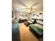 Cozy bedroom featuring twin beds, ceiling fan, and decor shelves for a personalized touch at 5050 Forest Ridge Dr, Hickory, NC 28602