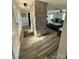 Entryway featuring a stone accent wall, with an open view to a spacious living room at 5050 Forest Ridge Dr, Hickory, NC 28602
