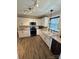 Bright kitchen with white cabinets, subway tile backsplash, stainless appliances, and a large sink at 5050 Forest Ridge Dr, Hickory, NC 28602