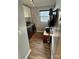 A laundry room with a utility sink, front loading washer and dryer and wood look flooring at 5050 Forest Ridge Dr, Hickory, NC 28602