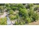 Aerial view showcasing the home's location within a mature, tree-filled neighborhood and its proximity to nearby amenities at 56 Blume Sw Ave, Concord, NC 28025