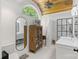 Elegant bathroom with a vaulted ceiling, subway tile shower, and double sinks at 56 Blume Sw Ave, Concord, NC 28025