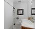 Compact bathroom featuring black and white hexagon tile, and a modern sink in a cozy space at 56 Blume Sw Ave, Concord, NC 28025