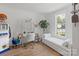 Bright bedroom featuring a desk, daybed, and stylish decor perfect for relaxing and working at 56 Blume Sw Ave, Concord, NC 28025