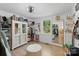 Bright bedroom with hardwood floors, featuring a large window and ample closet and storage space at 56 Blume Sw Ave, Concord, NC 28025