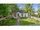 Charming house featuring a well-maintained lawn and a charming white picket fence at 56 Blume Sw Ave, Concord, NC 28025