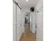 Bright hallway with hardwood floors, showcasing sliding barn doors and access to other rooms at 56 Blume Sw Ave, Concord, NC 28025
