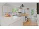 Charming kitchen with white countertops and cabinets, stainless steel appliances, and a wood-topped island cooktop at 56 Blume Sw Ave, Concord, NC 28025