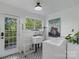 Charming laundry room with vintage accents, featuring a utility sink and modern washer at 56 Blume Sw Ave, Concord, NC 28025