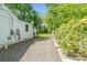 Gravel side yard enhanced with wood pallet planters, and privacy fencing at 56 Blume Sw Ave, Concord, NC 28025