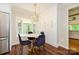 Dining area features a round table with seating and bright lighting with built in storage and modern design at 5916 Rexwood Pl, Charlotte, NC 28210
