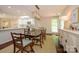 Well-lit dining area adjacent to the modern kitchen at 5916 Rexwood Pl, Charlotte, NC 28210