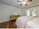 The bright main bedroom has French doors leading to the back yard, hardwood floors, and neutral paint at 5916 Rexwood Pl, Charlotte, NC 28210