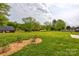 Expansive backyard offers mature trees and landscaping at 604 Airport Rd, Kannapolis, NC 28081
