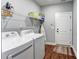 Functional laundry room with shelving, washer, and dryer units at 604 Airport Rd, Kannapolis, NC 28081