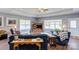 Spacious living room with tray ceiling, large windows, and stylish furniture, perfect for relaxing and entertaining at 604 Airport Rd, Kannapolis, NC 28081