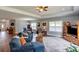 Open-concept living room flows into the dining area with ample seating and natural light, ideal for gatherings at 604 Airport Rd, Kannapolis, NC 28081