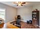 Office featuring a desk, office chair, and bookshelf with wooden flooring and natural light at 604 Airport Rd, Kannapolis, NC 28081