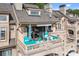 Inviting balcony featuring comfortable seating, a table, and an awning for relaxation and outdoor enjoyment at 657 Portside Dr, Davidson, NC 28036