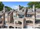 Multi-story home featuring a patio, balconies, awnings, and scenic views for upscale living at 657 Portside Dr, Davidson, NC 28036