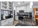 Updated kitchen features modern stainless steel appliances and custom white cabinets at 657 Portside Dr, Davidson, NC 28036