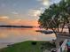 Scenic view of the lake and surrounding landscape at sunset, complete with boat docks at 657 Portside Dr, Davidson, NC 28036