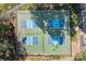 Aerial view of four pickleball courts in a wooded area, with people playing on one of the courts at 657 Portside Dr, Davidson, NC 28036