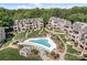 Serene community featuring a stylish pool, lush landscaping, and inviting patios for luxury living at 657 Portside Dr, Davidson, NC 28036