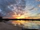 Beautiful sunset view over a calm lake, offering a serene and picturesque waterfront experience at 657 Portside Dr, Davidson, NC 28036