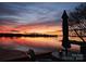 Picturesque view of a stunning sunset over the water, creating a serene and inviting atmosphere at 657 Portside Dr, Davidson, NC 28036