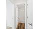 Bathroom with shower and wood-look floors at 6647 Vlosi Dr, Charlotte, NC 28226