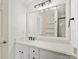 Bathroom featuring white vanity with marble countertop, matte black hardware, and large mirror at 6647 Vlosi Dr, Charlotte, NC 28226
