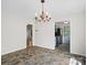 Dining room with chandelier, decorative tile flooring, and open layout at 6647 Vlosi Dr, Charlotte, NC 28226