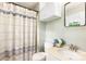 Bathroom featuring a vanity area, toilet, and shower with patterned curtain at 6718 Summerlin Pl, Charlotte, NC 28226