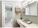 Bathroom featuring a vanity area with drawers and a bathtub with shower at 6718 Summerlin Pl, Charlotte, NC 28226