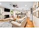 Open-concept living area with hardwood floors, fireplace, and adjacent kitchen at 6718 Summerlin Pl, Charlotte, NC 28226