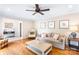 Comfortable living room with sofa, chair, and a view into entry hall at 6718 Summerlin Pl, Charlotte, NC 28226