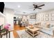 Inviting living room with a fireplace and open access to the beautifully updated kitchen at 6718 Summerlin Pl, Charlotte, NC 28226