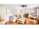 Inviting living room with comfortable seating and hardwood floors at 6718 Summerlin Pl, Charlotte, NC 28226