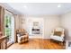 Cozy living room with hardwood floors and neutral decor, bathed in natural light at 6718 Summerlin Pl, Charlotte, NC 28226