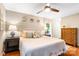 Spacious bedroom features hardwood floors, soft lighting, and a ceiling fan at 6718 Summerlin Pl, Charlotte, NC 28226