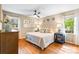 Cozy main bedroom featuring hardwood floors and ample natural light at 6718 Summerlin Pl, Charlotte, NC 28226
