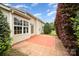 View of backyard patio, siding, large windows, hedges, and lawn at 6849 Blake Brook Dr, Concord, NC 28025