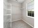 Walk-in closet with gray carpet, white wire shelves and a window at 6849 Blake Brook Dr, Concord, NC 28025