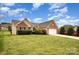 Exterior view of home with brick and siding, an attached two-car garage, and a lush green lawn at 6849 Blake Brook Dr, Concord, NC 28025