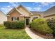Charming single Gathering house with brick and siding and green lawn and shrubbery at 6849 Blake Brook Dr, Concord, NC 28025
