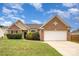 Charming brick and siding home with a well-manicured lawn and attached two-car garage at 6849 Blake Brook Dr, Concord, NC 28025