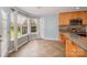 Eat-in kitchen features wood cabinets, granite countertops, tile backsplash, stainless appliances, and a breakfast area at 6849 Blake Brook Dr, Concord, NC 28025
