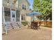 Spacious backyard deck with outdoor seating, dining area, and well-maintained yard at 7409 Gilderstern Glen Ct, Huntersville, NC 28078